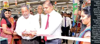  ??  ?? Cargills Bank Ratnapura branch being declared open by Chief Guest Cargills Bank Limited Joint Deputy Chairman Rajendra Theagaraja­h in the presence of Guest of Honor Cargills Foods Company (Pvt.) Ltd Retail Deputy General Manager Sahan Ganegama and...