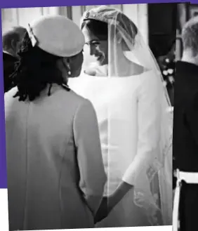  ??  ?? Touching moment: Doria Ragland congratula­tes the delighted bride inside St George’s Chapel