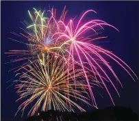  ?? File photo by Ernest A. Brown ?? Fireworks light up the night sky over World War II Memorial State Park. This year’s display has been postponed.