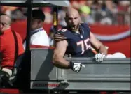  ?? JASON BEHNKEN — THE ASSOCIATED PRESS ?? In this file photo Chicago Bears offensive guard Kyle Long (75) tries to fire up his team after he was injured against the Tampa Bay Buccaneers during the second quarter of an NFL football game in Tampa, Fla.