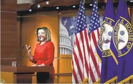  ?? DREW ANGERER GETTY IMAGES ?? House Speaker Nancy Pelosi said Friday that after months of inaction, there is growing momentum in Congress for a $908 billion coronaviru­s relief package.