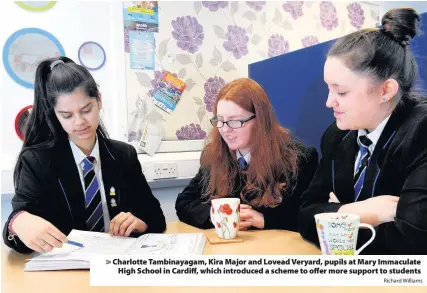  ?? Richard Williams ?? > Charlotte Tambinayag­am, Kira Major and Lovead Veryard, pupils at Mary Immaculate High School in Cardiff, which introduced a scheme to offer more support to students