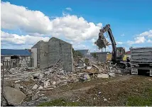  ??  ?? The first set of council flats at Papaioea Place hit the dust.