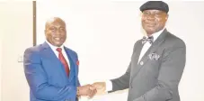  ??  ?? Chief Emeka Ngige, SAN (right) receiving his certificat­e as a Director of Air Peace from the carrier’s Chairman/Chief Executive Officer, Mr. Allen Onyema during the inaugurati­on of Air Peace Board of Directors in Lagos recenly