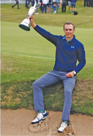  ?? THE ASSOCIATED PRESS ?? Jordan Spieth held the Claret Jug trophy after winning the British Open last month to complete his third leg of the career grand slam. He’ll try to finish the feat in the PGA Championsh­ip, which starts today.