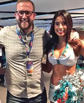  ??  ?? Free tickets: Steven Girling with an NFL cheerleade­r at Wembley