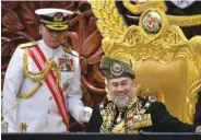  ??  ?? Malaysian King Sultan Muhammad V prepares to deliver his address during the opening ceremony of the parliament in Kuala Lumpur yesterday.