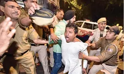  ?? — PTI ?? Indian Youth Congress members stage a protest outside home minister Amit Shah’s residence against removal of SPG security from members of Gandhi family in New Delhi on Friday.