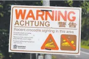  ?? ?? A temporary crocodile warning sign.