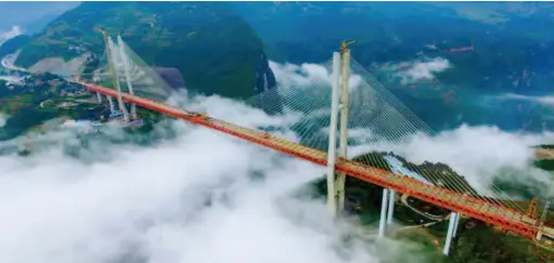  ??  ?? The Beipan River Bridge linking Duge Town of Liupanshui City in Guizhou Province and Puli Township of Xuanwei City in Yunnan Province, which opened to traffic at the end of 2016. VCG