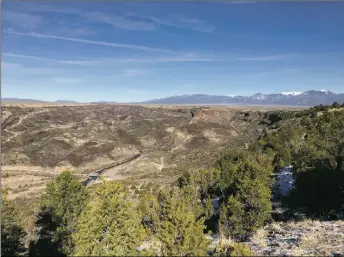  ?? STACI MATLOCK/Taos News ?? A view of the Río Grande Gorge at its confluence with the Río Pueblo from the Klauer Trail, one of many within the Río Grande del Norte National Monument that volunteers help maintain.