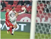  ??  ?? NIKOLAY ALEXANDROV/AP Iran’s captain Seyyed Jalal Hosseini (R) battles Russia’s Konstantin Rausch for the ball in the 1-1 draw in Kazan, Russia, on October 10, 2017.