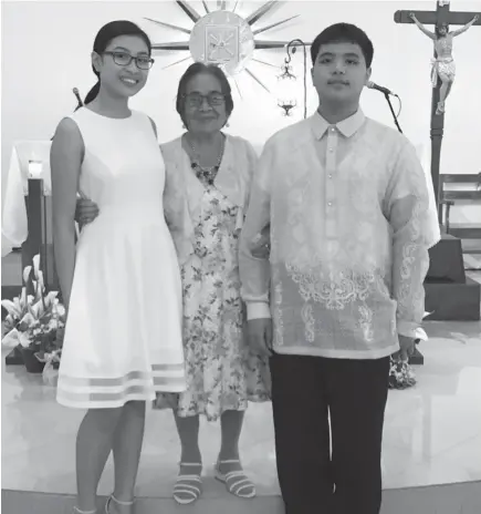  ??  ?? Still feeling positive because God is our ally. My two teens received the Sacrament of Confirmati­on and here they are posing with 94yr old great-granny. Their Dad told them to push through even if he and the youngest were still in the hospital.