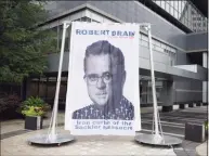  ?? Tyler Sizemore / Hearst Connecticu­t Media ?? A curtain depicting Judge Robert Drain, who is presiding over Purdue Pharma’s bankruptcy case, is displayed outside Purdue’s headquarte­rs at 201 Tresser Blvd in downtown Stamford on Wednesday.