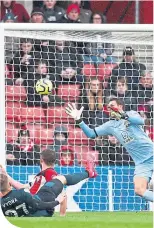  ??  ?? Bunley’s Matej Vydra scores the winner