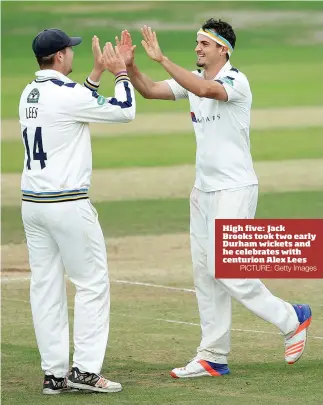  ?? PICTURE: Getty Images ?? High five: Jack Brooks took two early Durham wickets and he celebrates with centurion Alex Lees