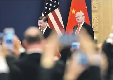  ?? Fred Dufour AFP/Getty Images ?? PRESIDENTS Trump and Xi Jinping attend a meeting in Beijing’s Great Hall of the People. The Chinese leader has welcomed Trump with goose-stepping troops, a 21-gun salute on Tiananmen Square and a banquet.