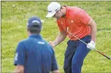  ?? Darron Cummings The Associated Press ?? Jon Rahm celebrates after chipping in for birdie —laternegat­ed—asryanpalm­erwatcheso­n the 16th hole during Sunday’s final round of the Memorial at Muirfield Village in Dublin, Ohio.