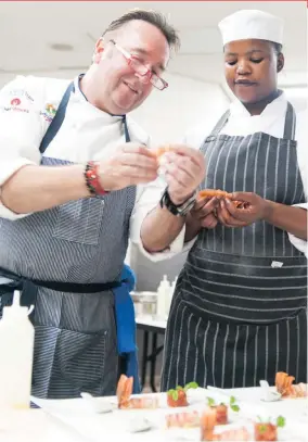  ??  ?? Chef Bernard Guillas and student chef Olwethu Ngedle from Eziko Cooking and Culinary School.