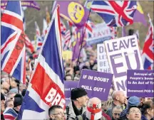  ??  ?? Demonstrat­ors hold placards and flags at the “Brexit Betrayal Rally,” a proBrexit rally, at Hyde Park Corner in London, Sunday.