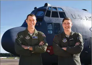  ?? U.S. AIR FORCE PHOTO BY SENIOR AIRMAN MERCEDES TAYLOR ?? Col. Jeffrey Armentrout, 302nd Airlift Wing vice commander at Peterson Air Force Base in Colorado Springs, Colo., left, and his son, Airman Trevor Armentrout, 700th Airlift Squadron loadmaster at Dobbins Air Reserve Base in Marietta, Ga., recently...