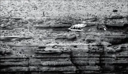  ?? ASSOCIATED PRESS PHOTO ?? IN THIS JUNE 23, 2013, FILE PHOTO, DAREDEVIL NIK WALLENDA CROSSES A TIGHTROPE 1,500 feet above the Little Colorado River Gorge, Ariz., on the Navajo Nation outside the boundaries of Grand Canyon National Park.