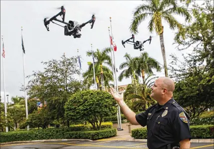  ?? YUTING JIANG / THE PALM BEACH POST ?? Maj. Paul Rogers gestures during a drone demonstrat­ion in Palm Beach Gardens. Rogers’ coursework at the FBI National Academy gave him ideas on how to bolster safety at special events such as the upcoming Honda Classic golf tournament.