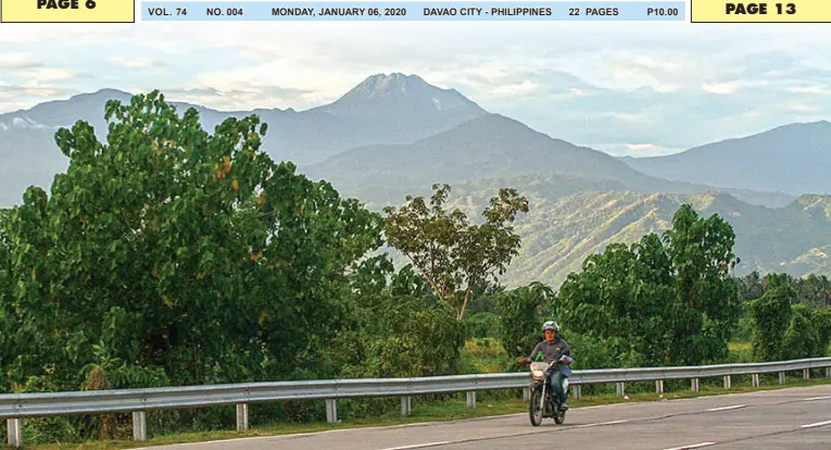  ??  ?? A MOTORIST whizzes by the highway in Padada, Davao del Sur late Friday afternoon as Mt. Apo, the country’s highest peak, shows all its glory in the far background. MindaNews photo by MANMAN DEJETO