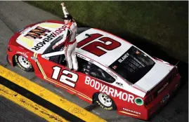  ?? (Logan Riely/getty Images) ?? Ryan Blaney, driver of the #12 Bodyarmor Ford, celebrates after winning the Cup Series Coke Zero Sugar 400 at Daytona Internatio­nal Speedway Saturday night.