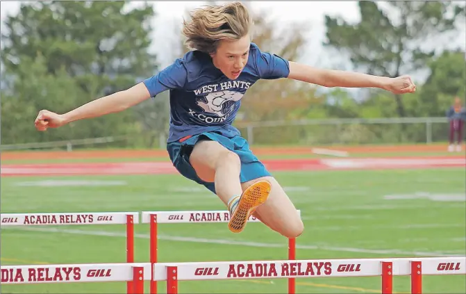  ?? JENNIFER VARDY LITTLE ?? Zachary James leaps over a hurdle for West Hants Middle School in the junior boys’ category during the first day of competitio­n in the district track and field meet held at Acadia May 16 and 17. See more coverage on page 12.