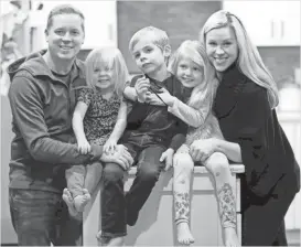  ?? MIKE DE SISTI / MILWAUKEE JOURNAL SENTINEL ?? Below: Melbourne Russell III (from left); Silvia, 2; Mel, 6; Elise, 5; and Nicole Russell gather in their Brookfield home. Mel has a metabolic disorder that was not diagnosed until after he suffered a stroke and brain damage. Elise suffers from the...