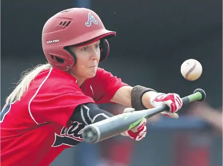  ?? DAN JANISSE ?? Team Ontario’s Ashley Stephenson put down a bunt during the Baseball Canada Women’s Invitation­al Championsh­ip against Team Quebec at Father Cullen Stadium at Mic Mac Park on Thursday.