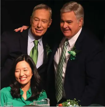  ?? NANCY LANE — BOSTON HERALD ?? Mayor Michelle Wu,Congressma­n Stephen Lynch and City Councilor Michael Flaherty sing during the St. Patrick’s Day Breakfast Sunday.