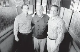  ??  ?? Dimitri Taras (center) operates Jim’s Place Grille in Colliervil­le with sons James (left), and Sam. “The best thing about working in a family business is that it’s so comfortabl­e,” James said.