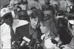  ?? NUCCIO DINUZZO/CHICAGO TRIBUNE FILE PHOTOGRAPH ?? Former Illinois Gov. Rod Blagojevic­h delivers a statement with his wife, Patti, at his side, on his last full day of freedom at his home on March 14, 2012 in Chicago, Ill.