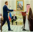  ?? Reuters ?? Representa­tives greet each other during the Saudi-Russian talks.