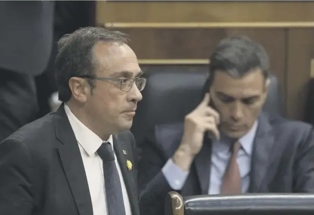  ?? PICTURE: PABLO BLAZQUEZ DOMINGUEZ ?? 0 Jailed Catalan separatist leader Josep Rull walks past Socialist leader Pedro Sanchez at the opening session at the Spanish Parliament