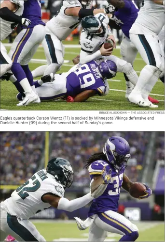  ?? BRUCE KLUCKHOHN — THE ASSOCIATED PRESS ?? Eagles quarterbac­k Carson Wentz (11) is sacked by Minnesota Vikings defensive end Danielle Hunter (99) during the second half of Sunday’s game.