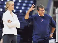  ?? Jessica Hill / Associated Press ?? UConn coach Geno Auriemma, right, gestures as assistant coach Shea Ralph watches practice before the team’s media day in 2012.