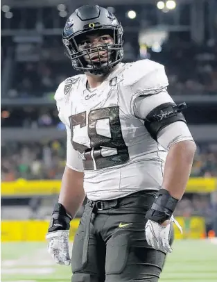  ?? RON JENKINS/AP ?? Oregon offensive lineman Penei Sewell (58) looks on as Oregon plays Auburn in Arlington, Texas.