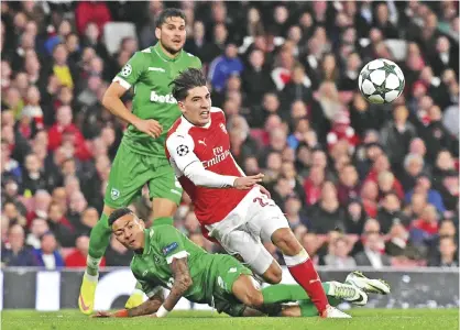  ??  ?? LONDON: Ludogorets’ Madagascan midfielder Anicet Abel (C) tackles Arsenal’s Spanish defender Hector Bellerin during the UEFA Champions League Group A football match between Arsenal and Ludogorets Razgrad at The Emirates Stadium in London yesterday. — AFP