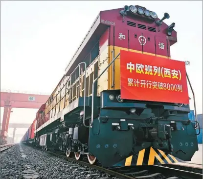  ?? ZHOU BOLUN / FOR CHINA DAILY ?? A freight train leaves Xi’an, capital of Shaanxi province, for Europe.