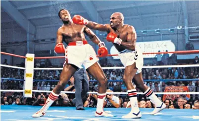  ?? ?? Shavers lands a devastatin­g right hand on Larry Holmes during their 1979 showdown and, below, pushing an ageing Ali to the brink of defeat in 1977