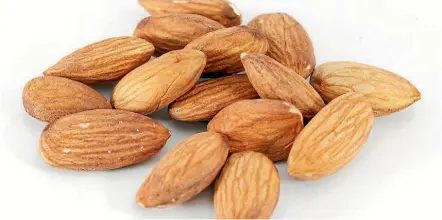  ??  ?? For vegetarian­s or vegans, almonds and some other nuts are a good source of protein.