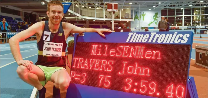  ??  ?? John Travers of Ireland with the clock showing his time of 3:59.40 and becoming the first Irishman to break 4:00 in Ireland for the Men’s Mile during AIT Internatio­nal Athletics Grand Prix at the AIT Internatio­nal Arena in Athlone. Photo by Brendan...