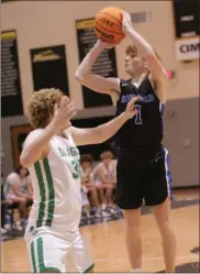  ?? ?? Ringgold’s Alex Otting goes up for a shot against Pickens during a tournament game last week at North Murray High School. The Tigers lost in overtime to the Dragons, but won their final two games of the week.