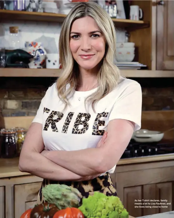  ??  ?? As her T-shirt declares, family means a lot to Lisa Faulkner, and she loves being close to home