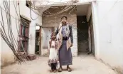  ??  ?? SIBLINGS stand in front of their ruined house, in Sadaa, Yemen. The country has been reeling due to war. STAFF WRITER