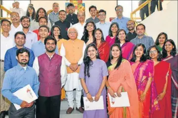  ?? HT PHOTO ?? Haryana chief minister Manohar Lal Khattar with newly inducted governance associates in Chandigarh on Saturday.