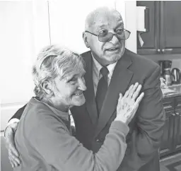  ?? TOM TINGLE/THE REPUBLIC ?? Bob McGuire visits his wife, Linda, at an adult-care home in Goodyear. Since her dementia diagnosis, her medical costs have increased.